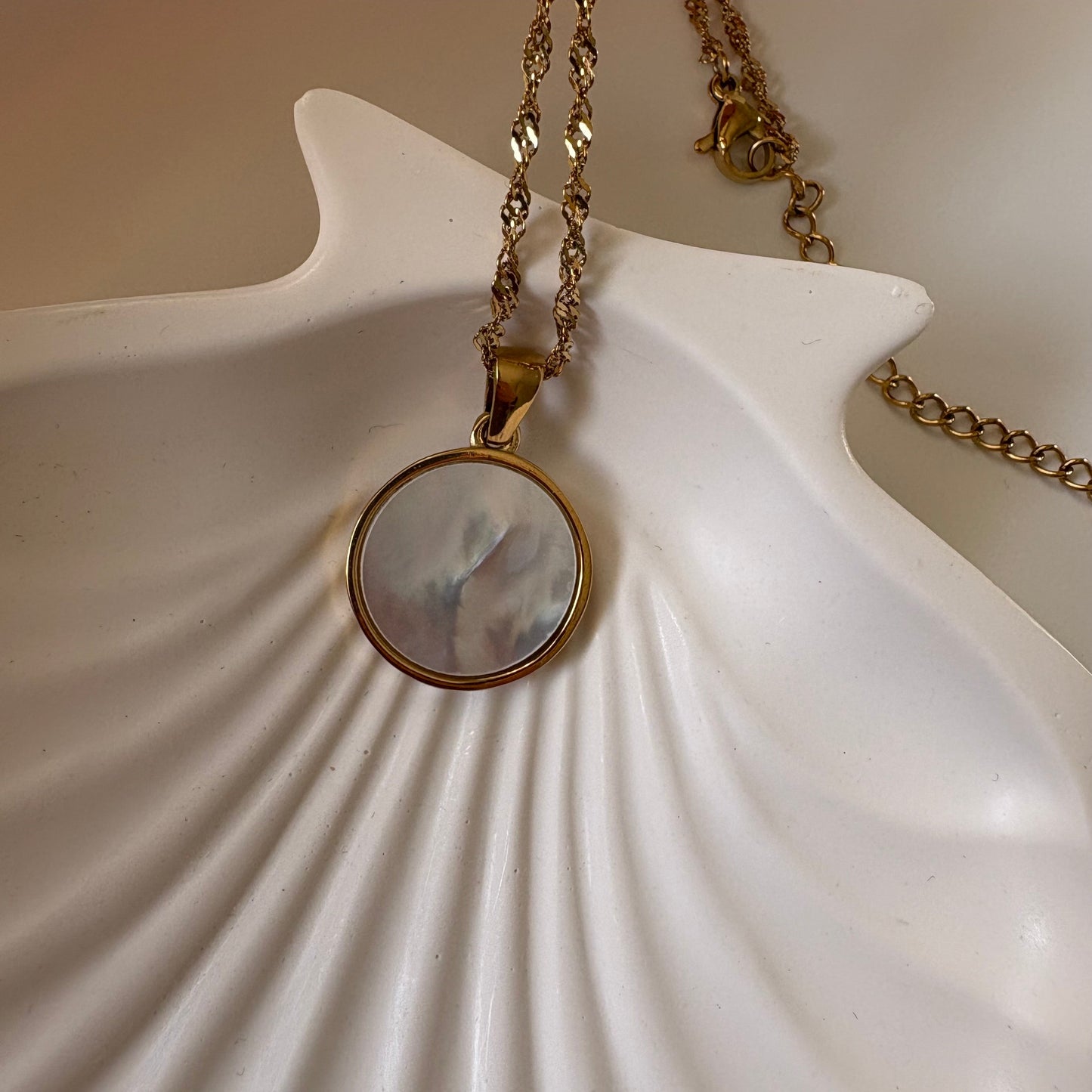 Dije parte de atras collar cosmos